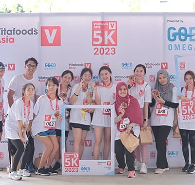 Group of 5k Run participants posing at the photo booth.